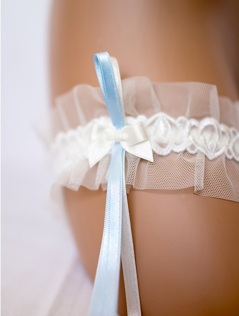 White bridal garter with a blue and white ribbon. 